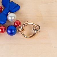 Load image into Gallery viewer, 70972 - USA Beaded Bow Phone Wristlet - Red White &amp; Blue
