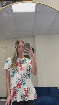 Load and play video in Gallery viewer, 30015 - Animal Print Ruffle Bottom Half Sleeve Top
