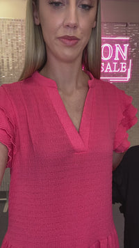 Load and play video in Gallery viewer, 50020 - Solid Color Textured Dress with Ruffled Sleeves and Pockets - Pink
